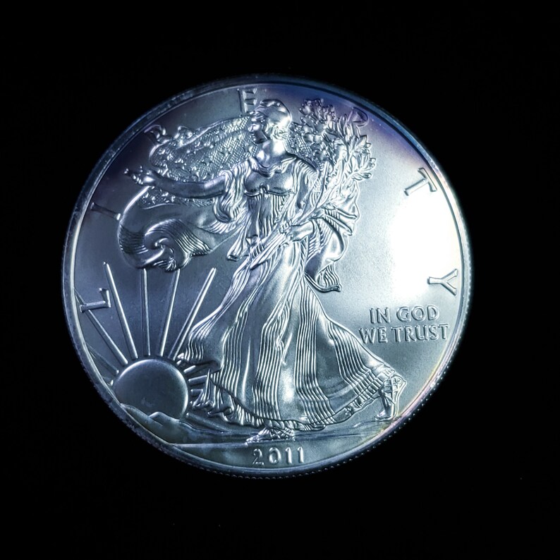 2011   American Silver Eagle BU  -  1 Oz .999 Cool toning on the rim-     Lot# 1210   Key date - usacoinsstore
