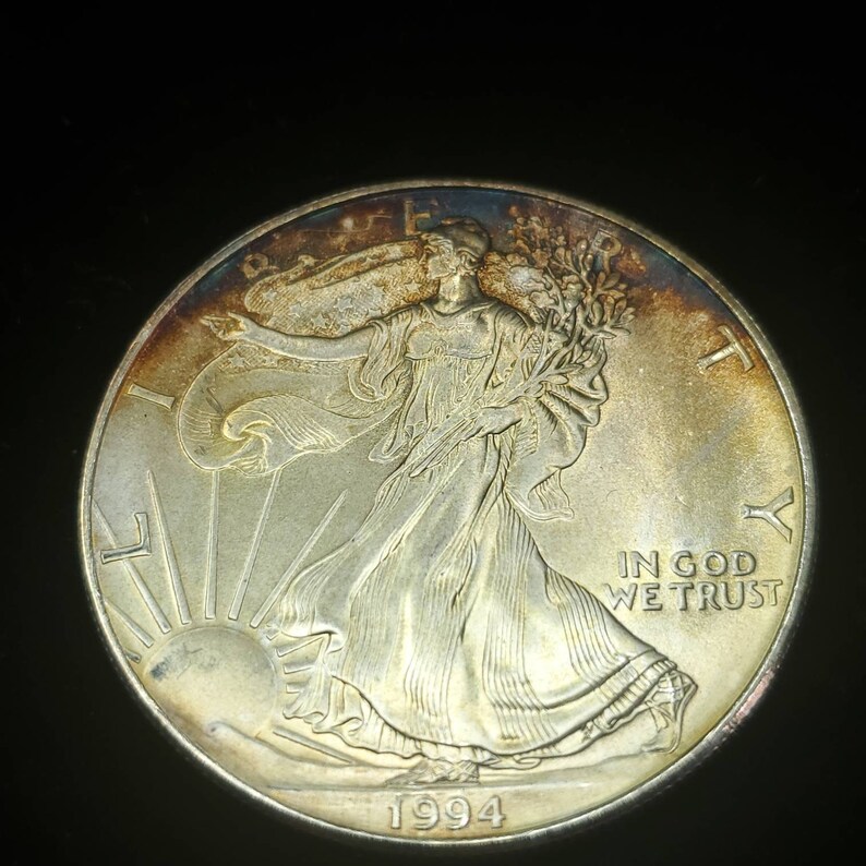 1994   American Silver Eagle  - Toned    -  1 Oz .999 Tough  Key date   Lot# 522 Regular 79 - usacoinsstore
