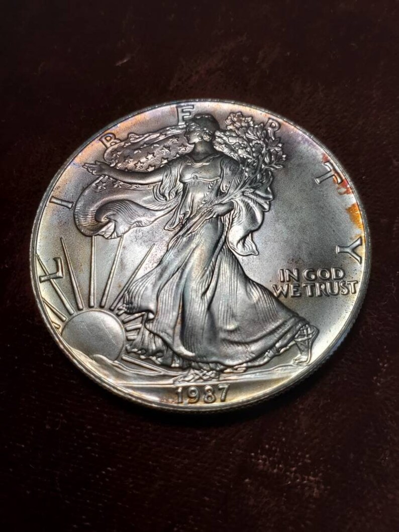 1987 American Silver Eagle BU  -  1 Oz .999 - Nice toning - Includes airtight capsule-  Lot# 475 - usacoinsstore