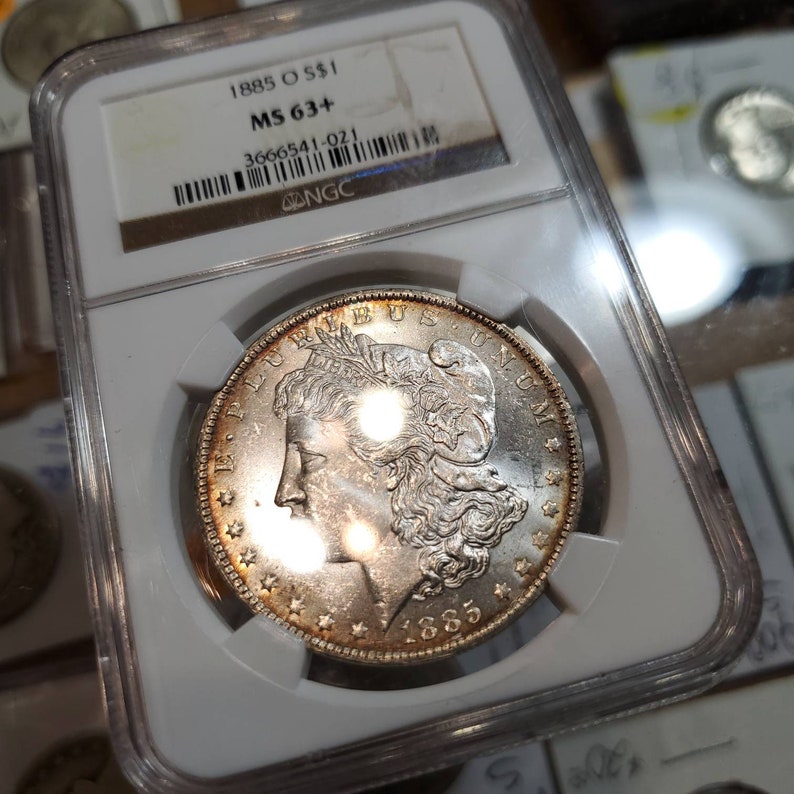 1885 O Morgan Silver Dollar, Nicely  Toned. NGC MS63+ lot#229 - usacoinsstore